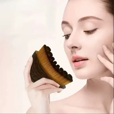 OPTISTASIS Lymphatic Sculpt Brush in use along the jawline for facial lymphatic drainage